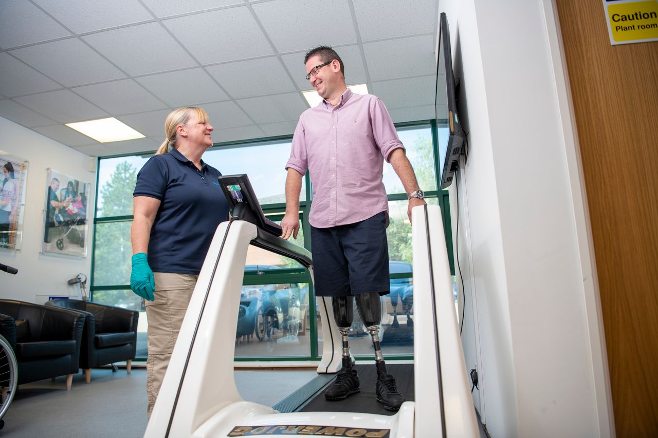 Image of Principal Prosthetist Jane Muir and bi-lateral below the knee amputee Steve North on treadmill