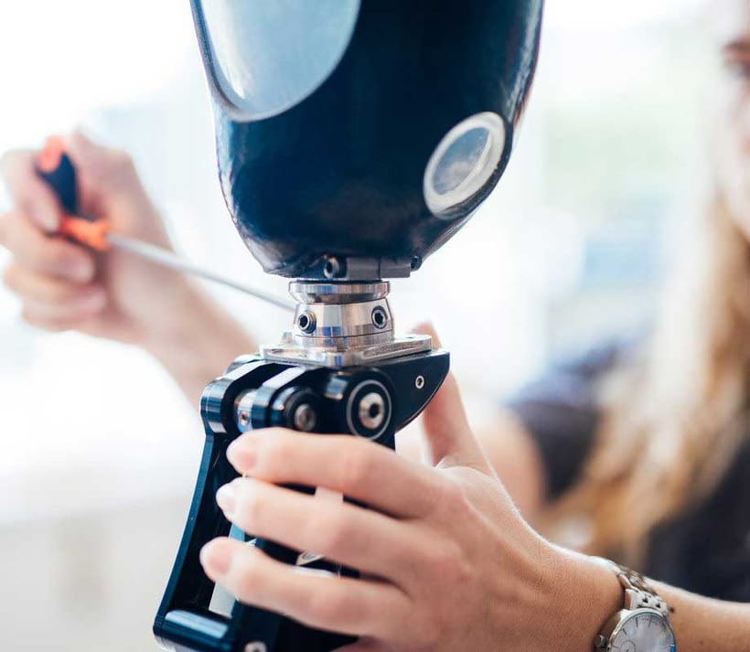 Technician Adjusting A Prosthetic